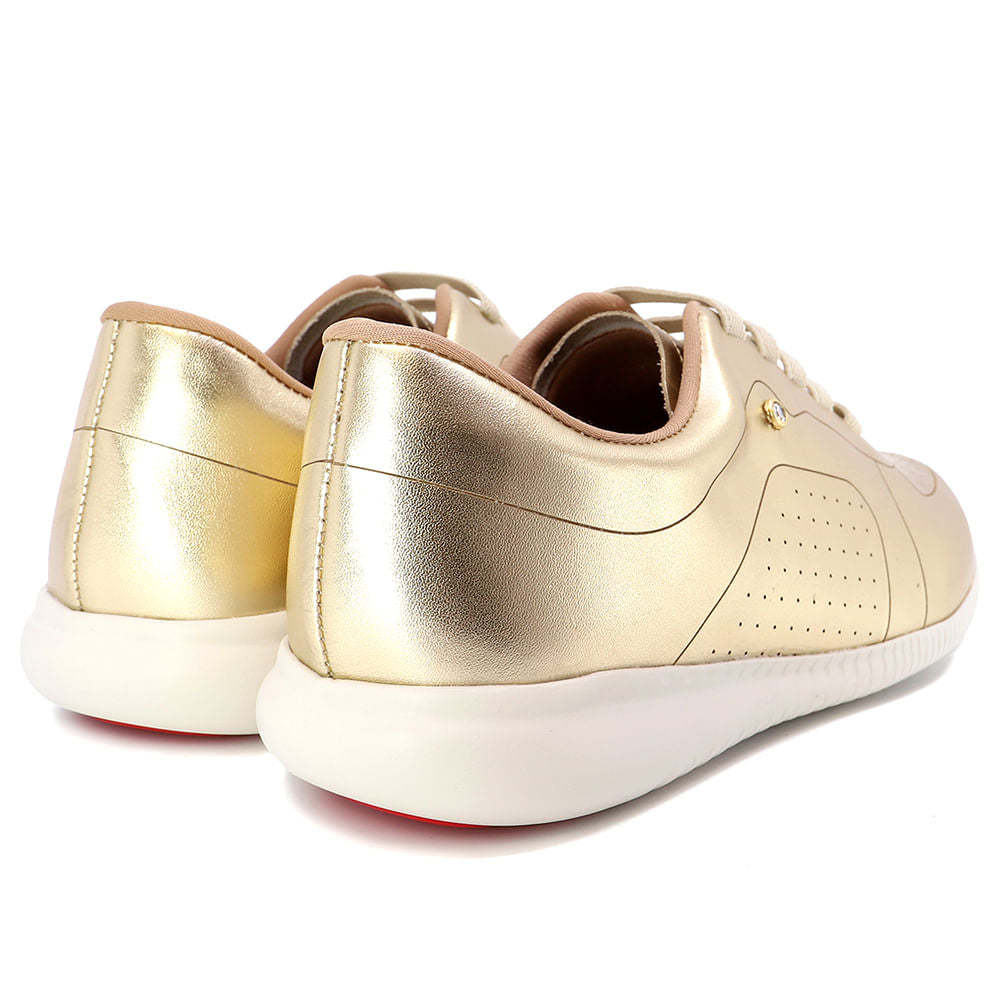 Baskets décontractées en cuir doré avec détails laser