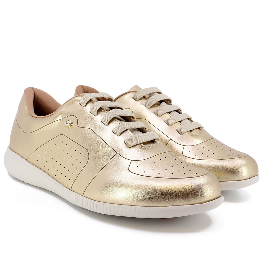 Baskets décontractées en cuir doré avec détails laser