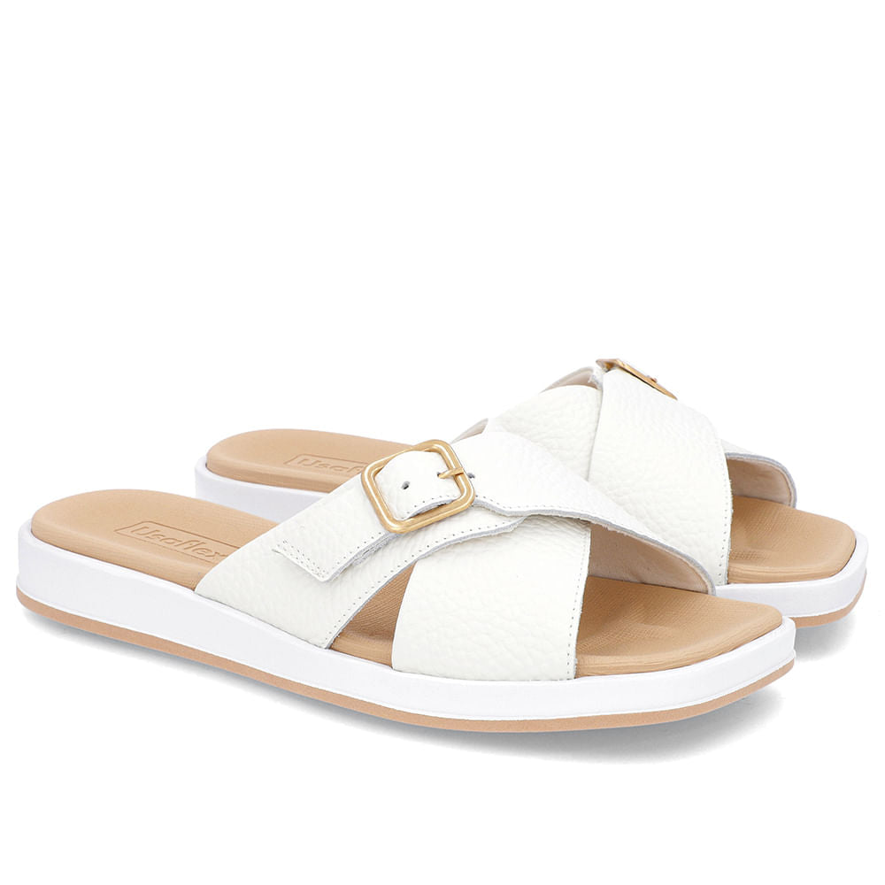 Claquettes blanches à talon bas et ornements en cuir