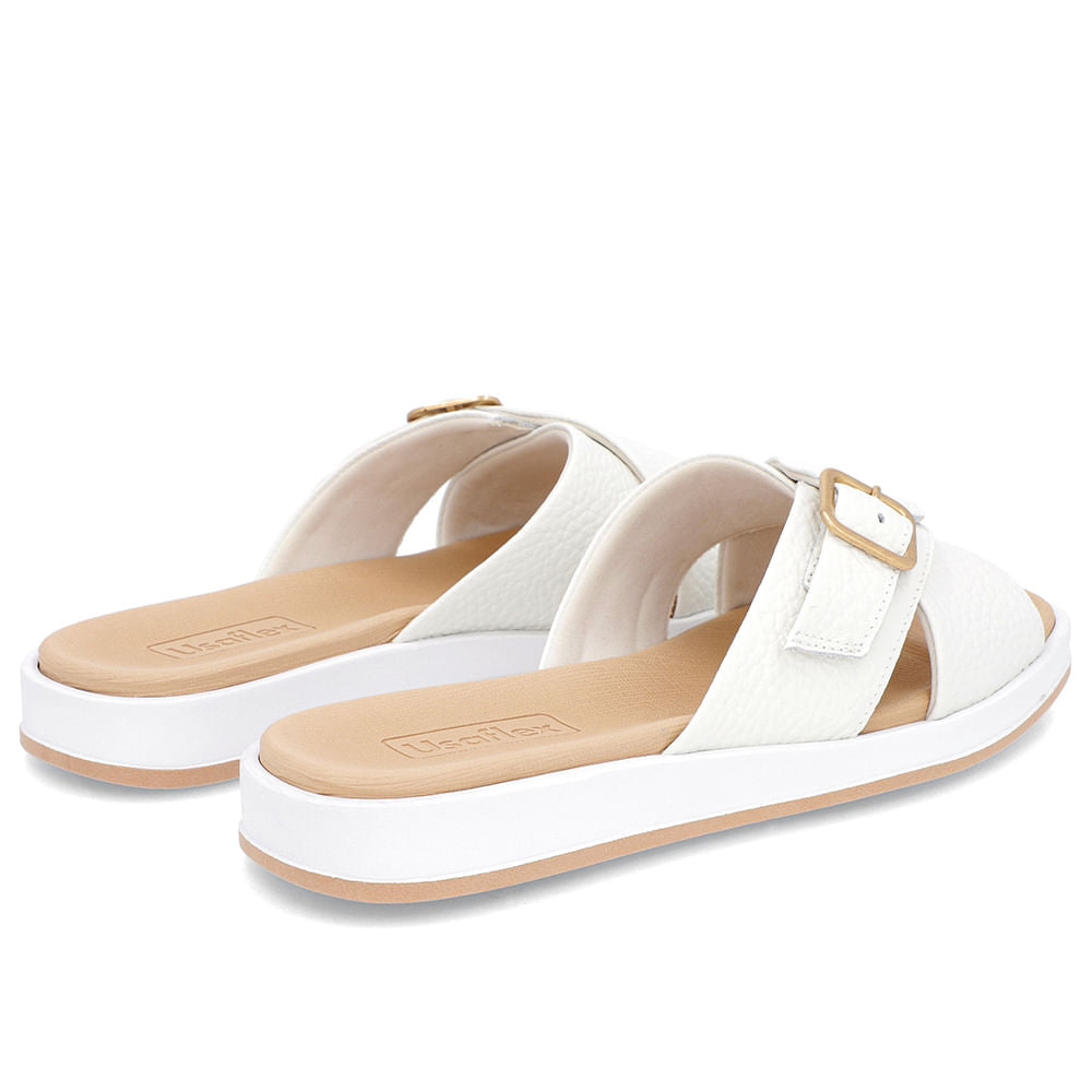 Claquettes blanches à talon bas et ornements en cuir
