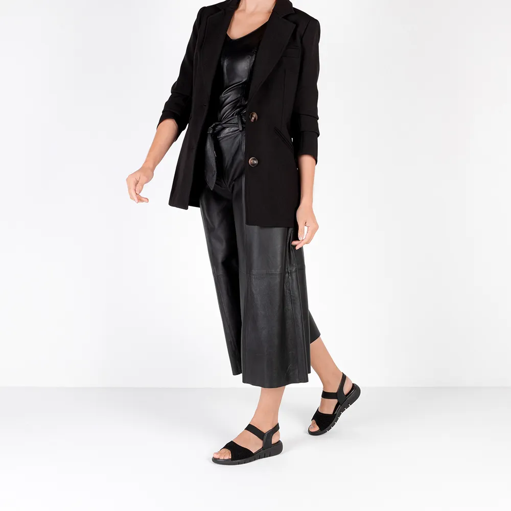 Sandale en tricot noir avec bride élastique