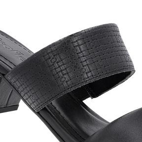 Sabots en cuir noir avec brides texturées